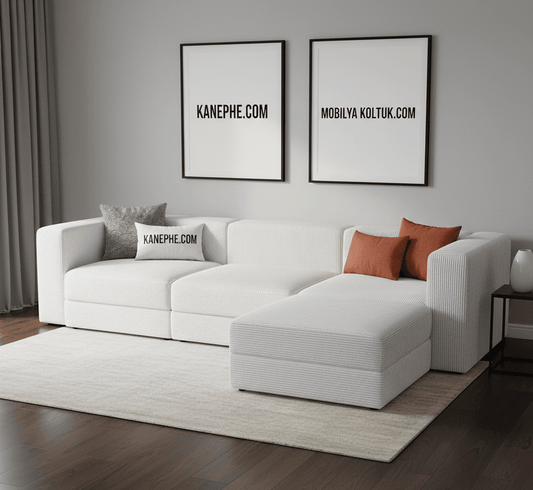 Modern beyaz köşe koltuk takımı, rahat yastıklarla şık bir oturma alanı sunuyor.