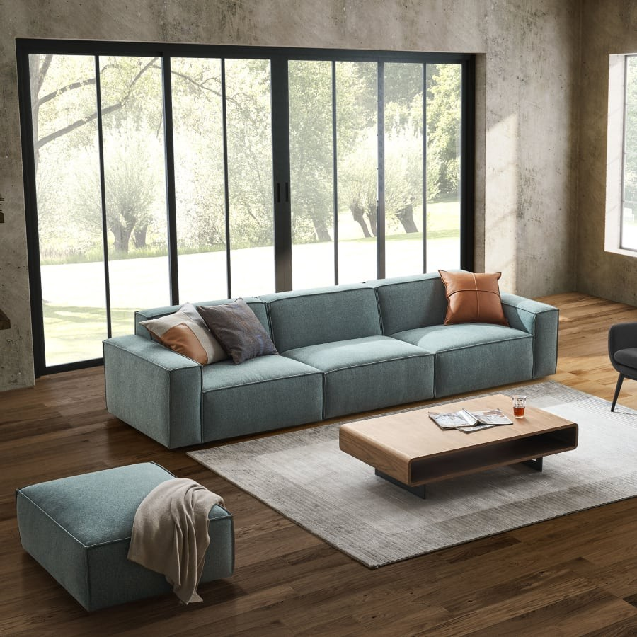 Modern tasarımlı mavi kumaş modüler köşe koltuk geniş oturma alanı ve konforlu yastıklarla