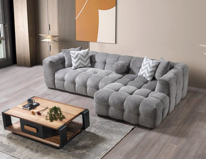 Gri modern köşe koltuk modeli, yumuşak döşemeli, konforlu oturma alanı ile şık oturma odası dekorasyonu